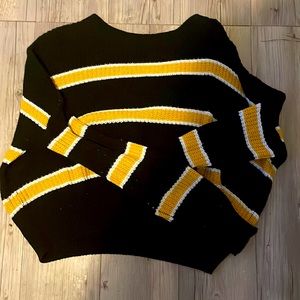 Black, yellow and white sweater. Worn a few times, but in great shape.